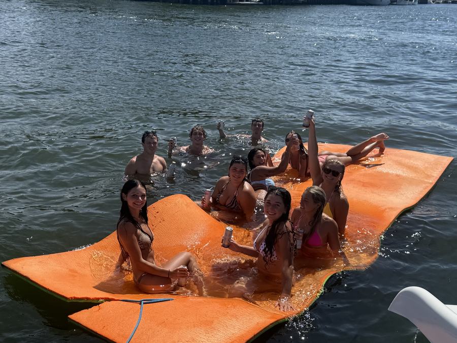 Group on orange floating mat Fort Lauderdale charter sandbar